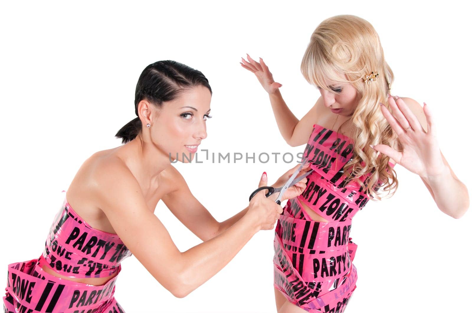 Two girls in pink tape dresses isolated on white