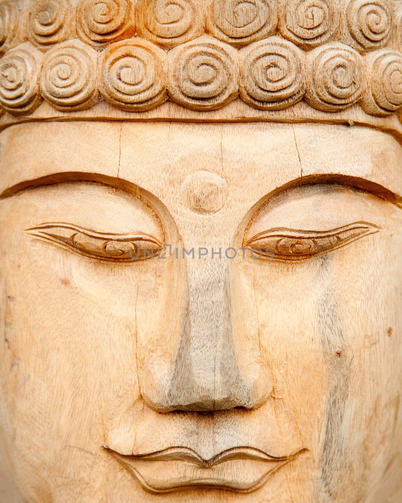 Woodcarved buddha for sale in a shop