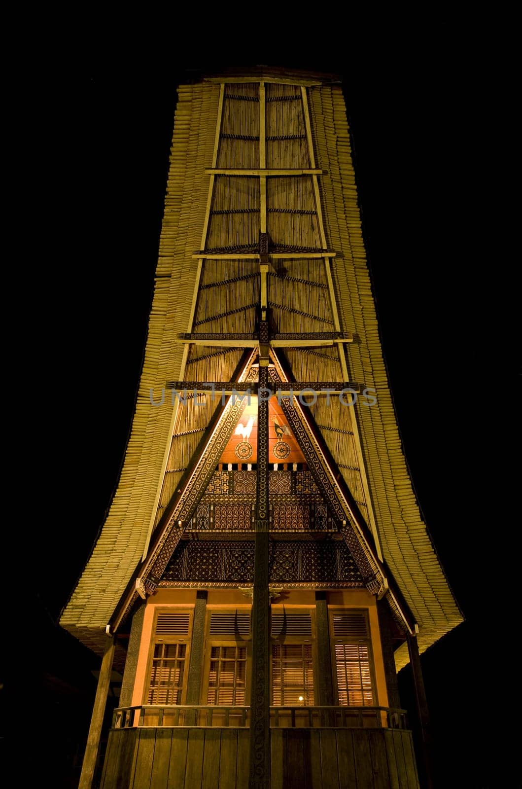 Traditional Toraja house (tongkonan) at night