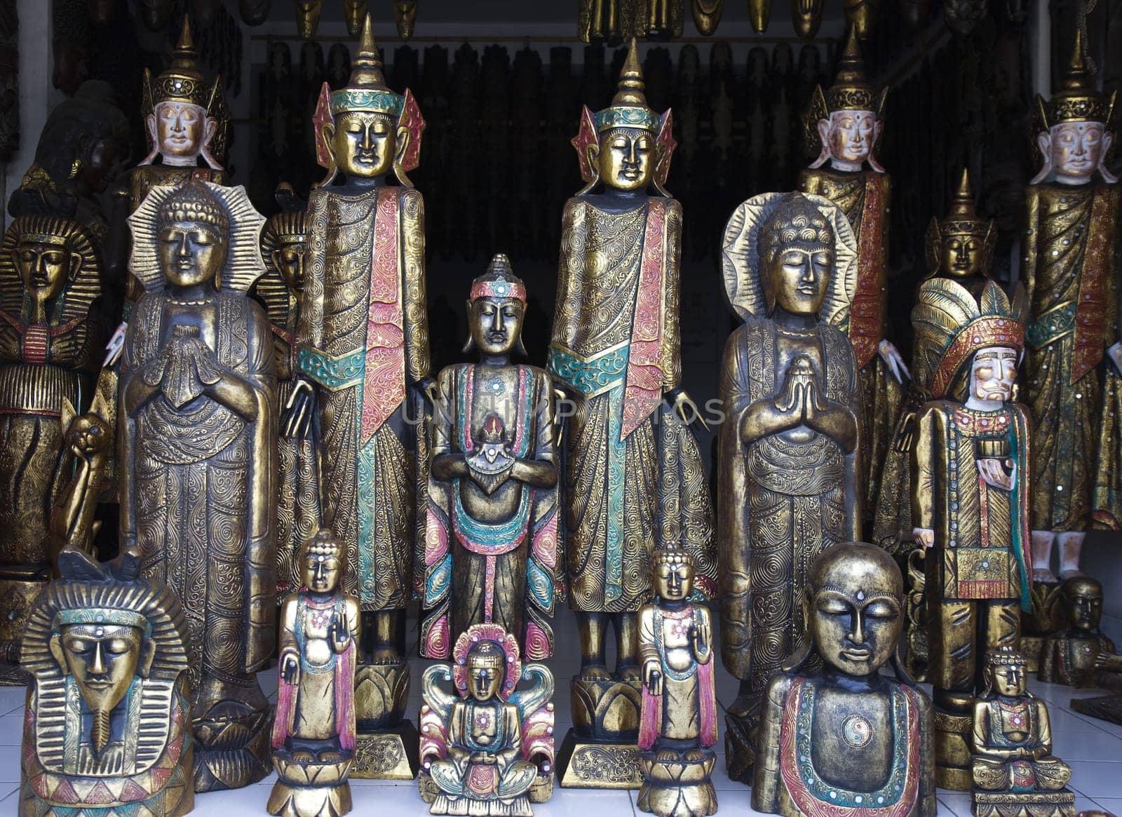 Woodcarved buddha's for sale in a shop