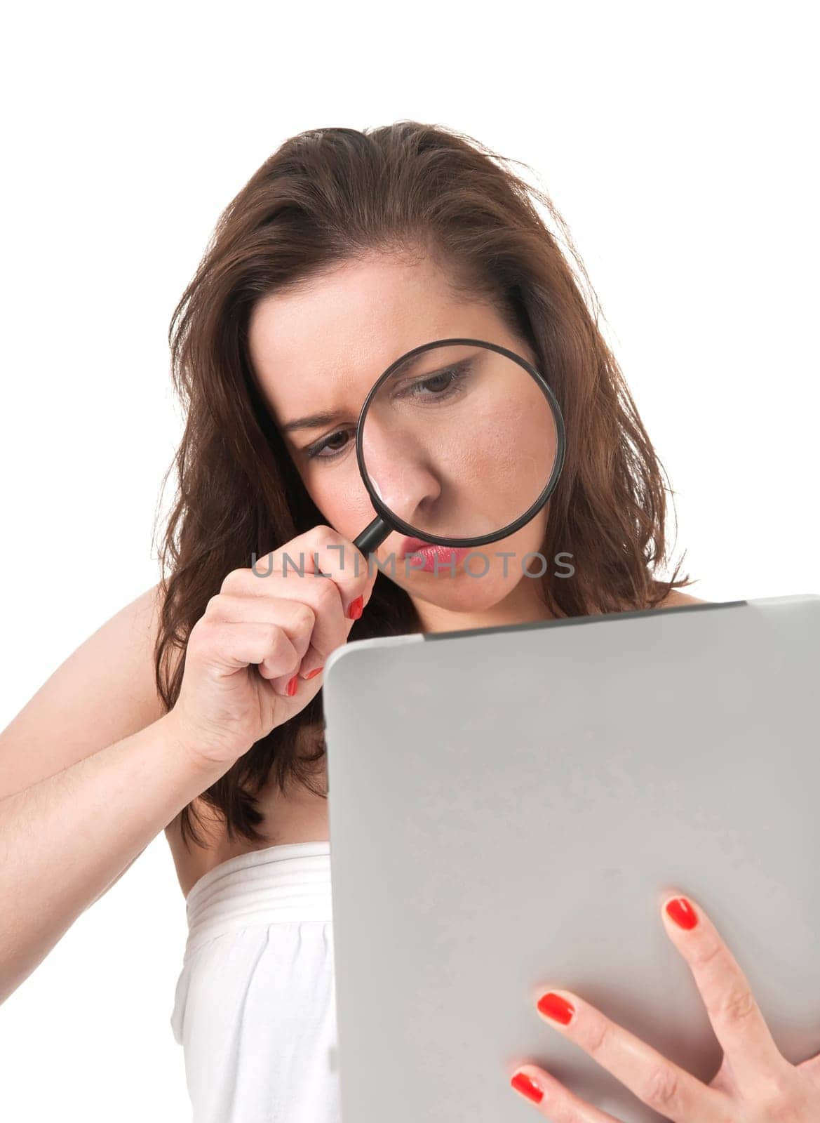 Woman with digital tablet and magnifying glass