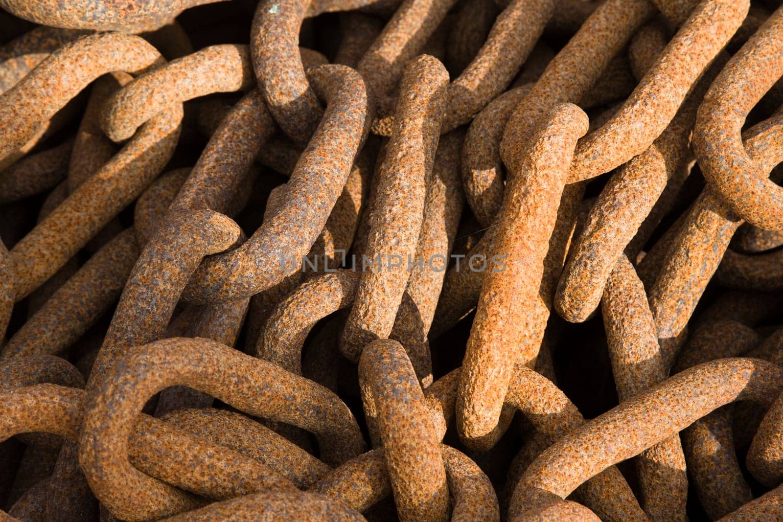 Rusty steel ship chains on a shipyard