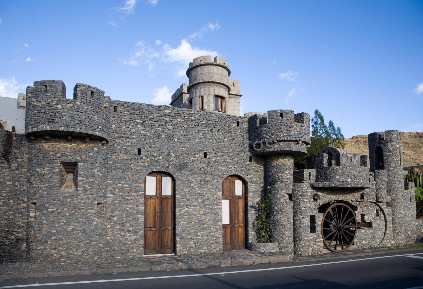 Miniature castle with grey stone gurrets in Santa Lucia de Tirajana, Gran Canaria