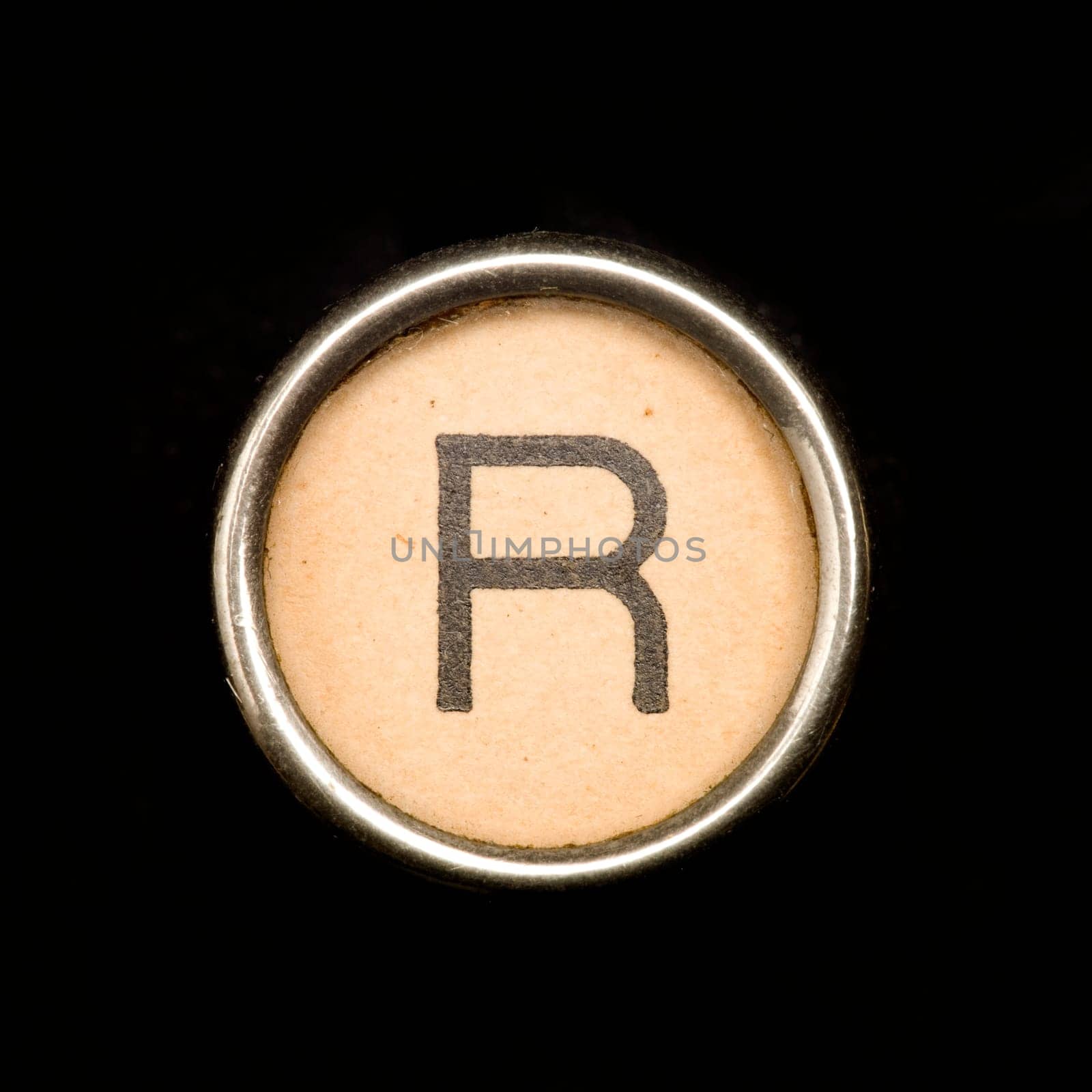 The R button on a complete alphabet of an antique typewriter