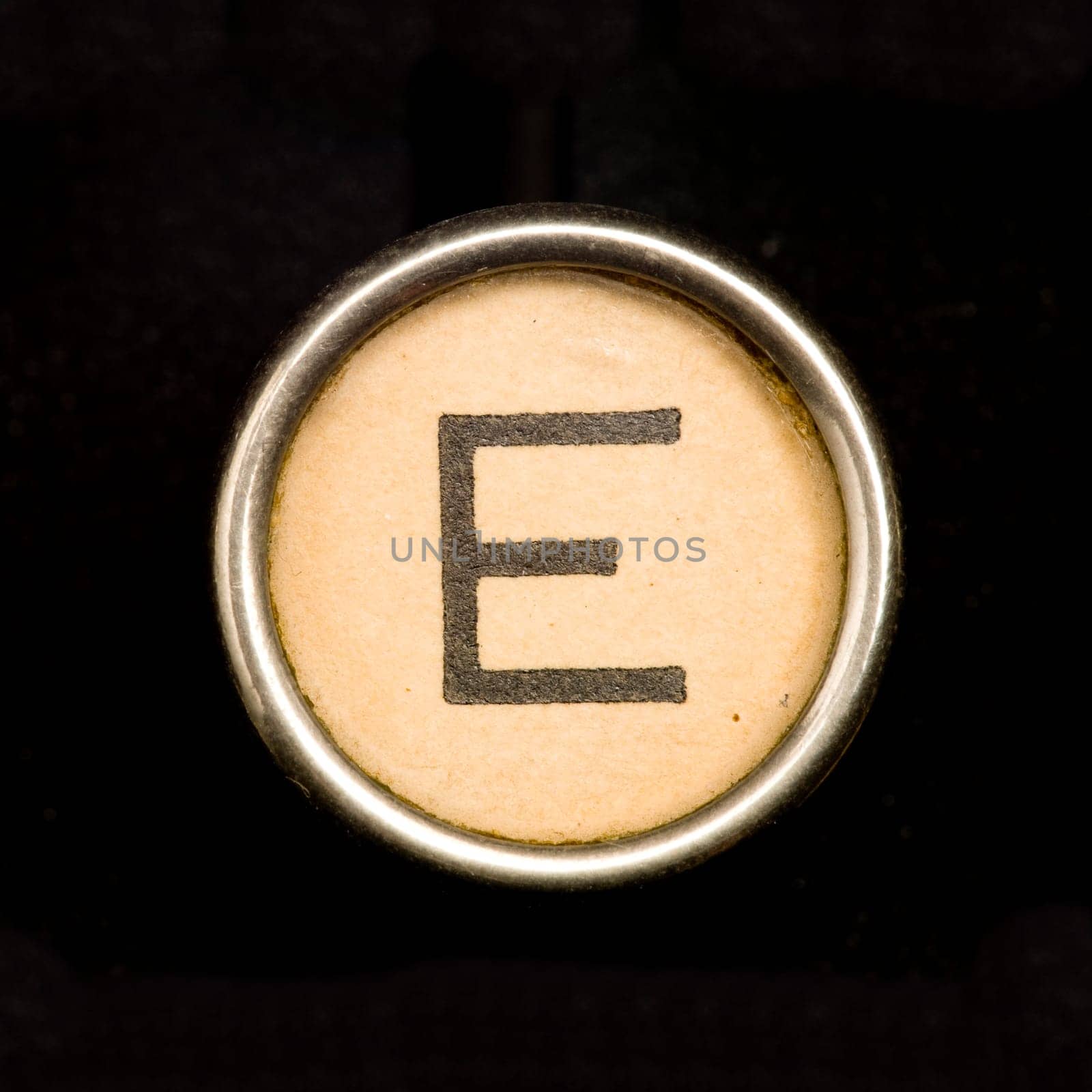 The E button on a complete alphabet of an antique typewriter