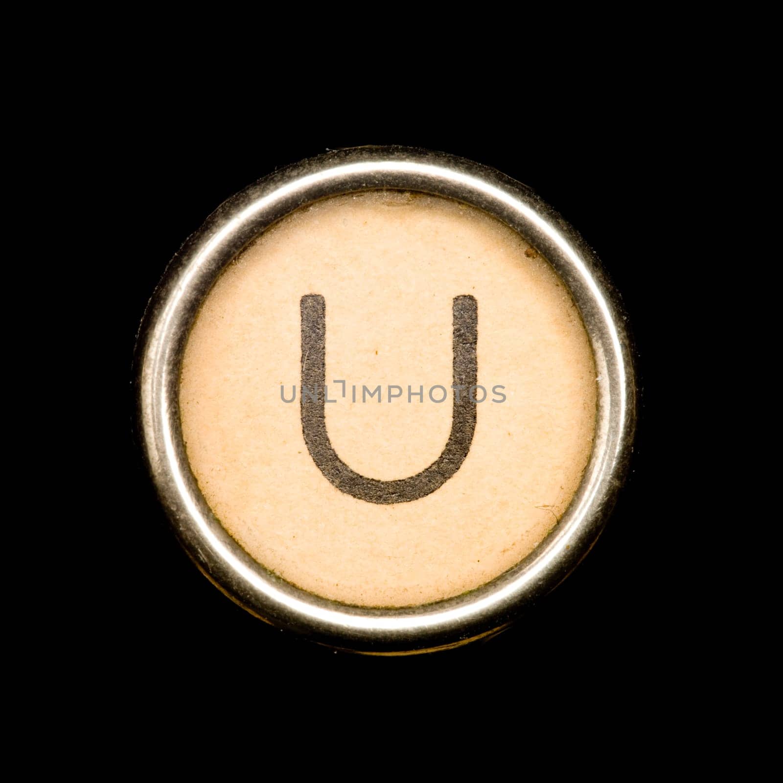 The U button on a complete alphabet of an antique typewriter