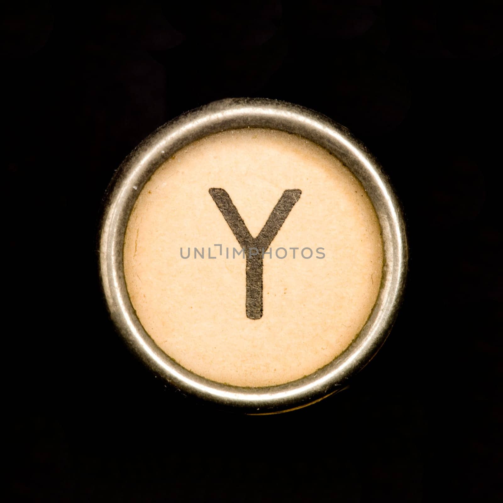 The Y button on a complete alphabet of an antique typewriter
