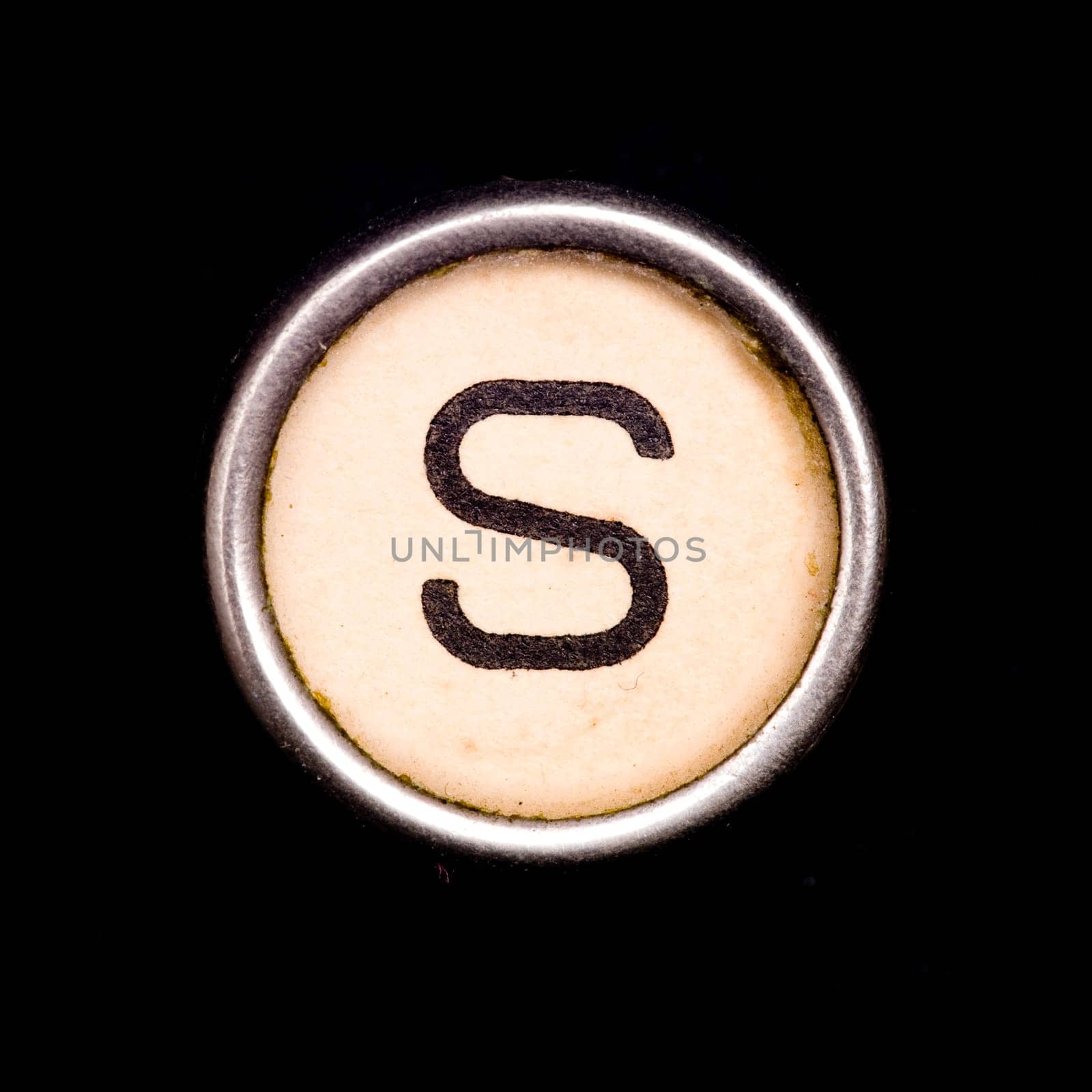 The S button on a complete alphabet of an antique typewriter