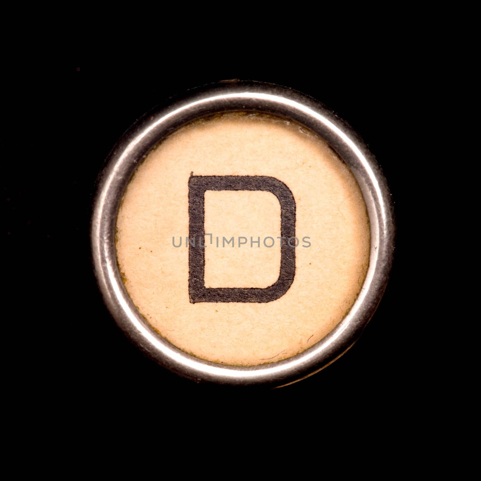The D button on a complete alphabet of an antique typewriter