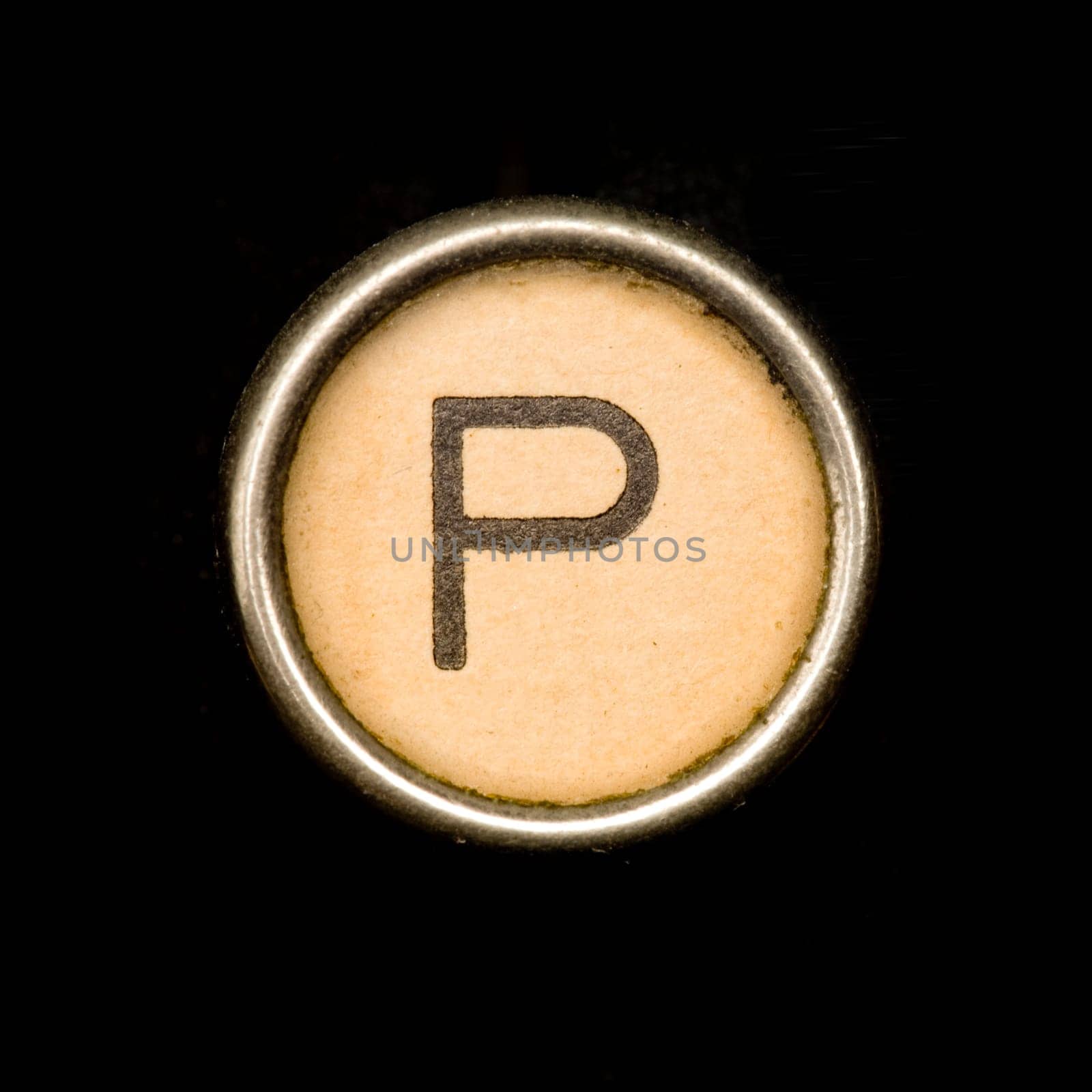 The P button on a complete alphabet of an antique typewriter