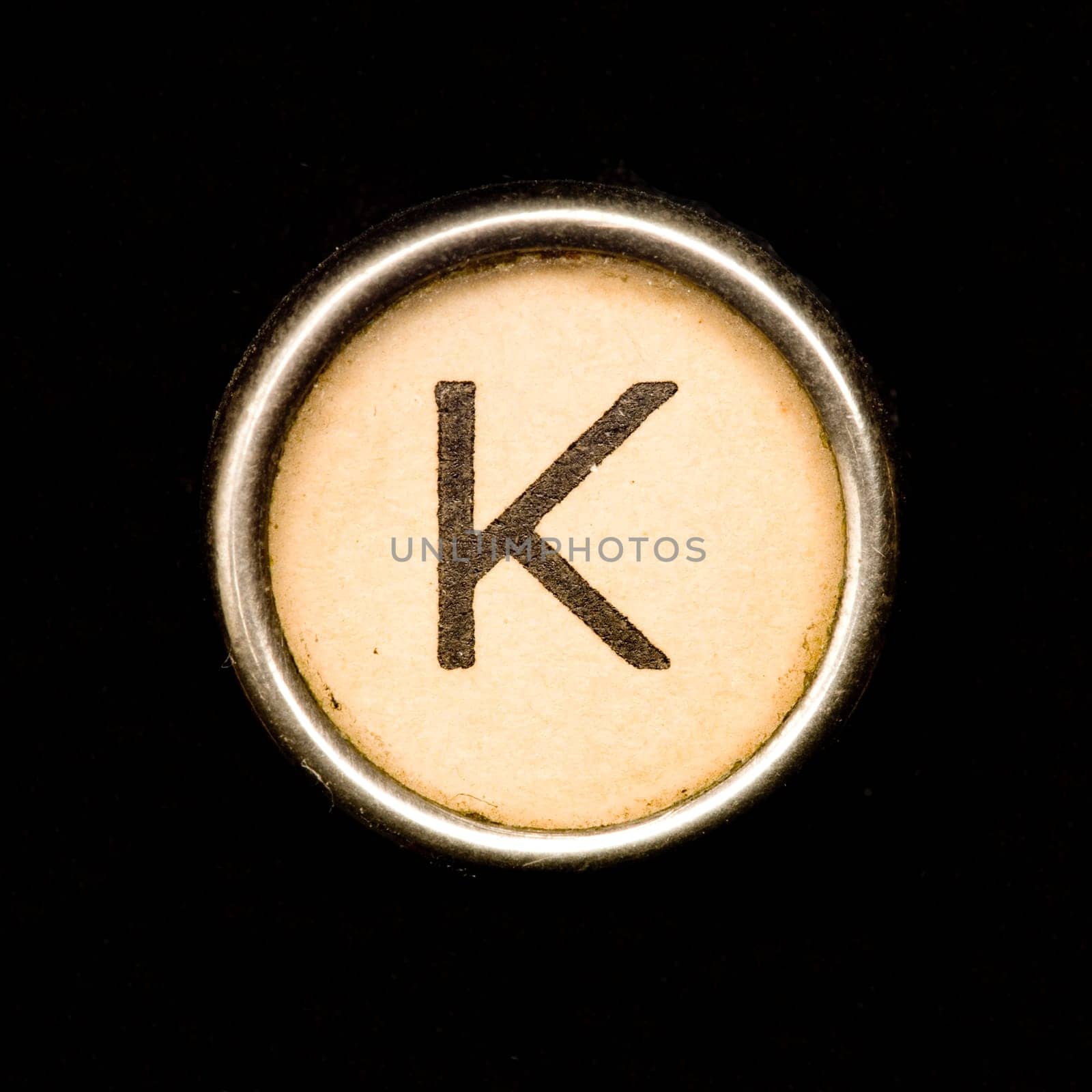 The K button on a complete alphabet of an antique typewriter
