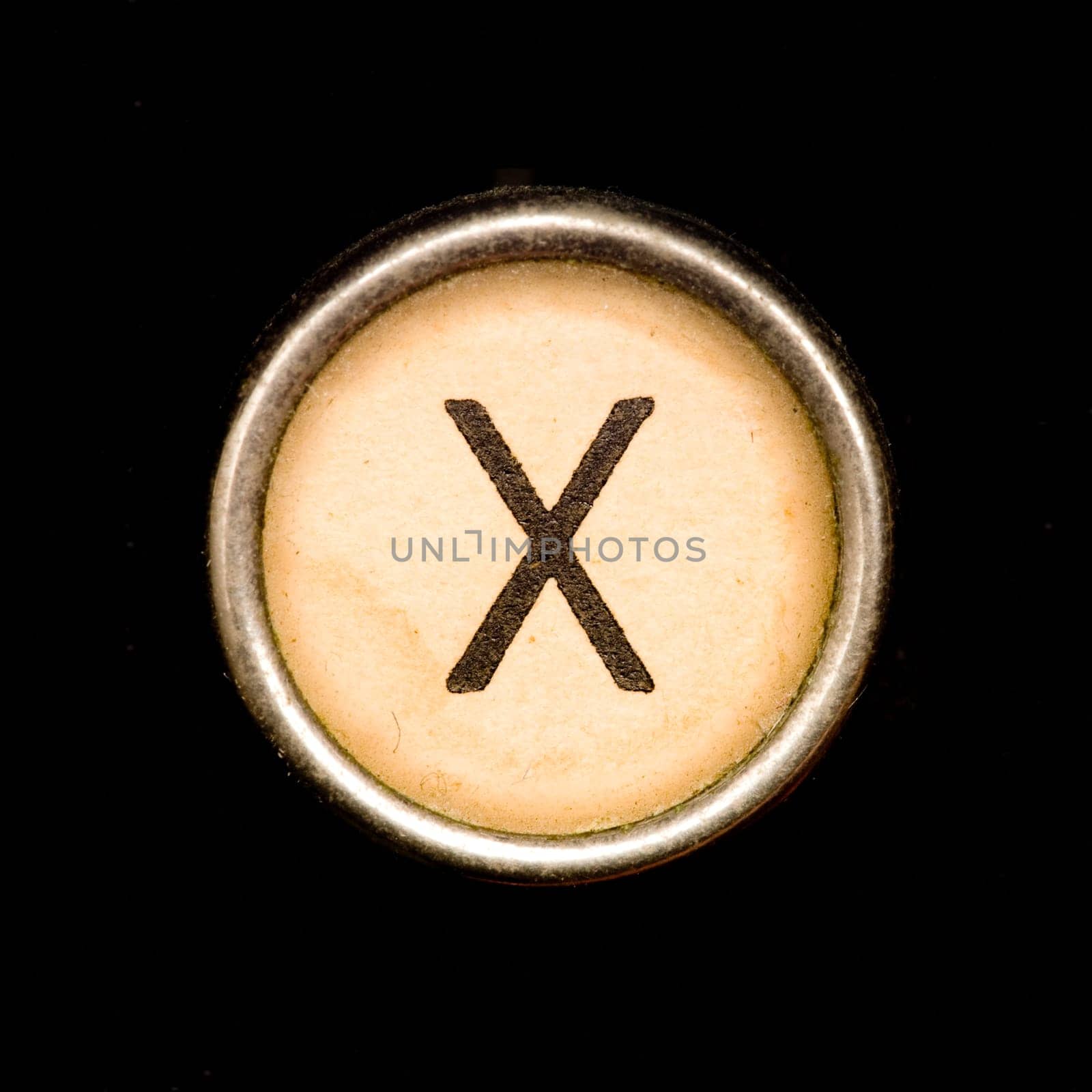 The X  button on a complete alphabet of an antique typewriter