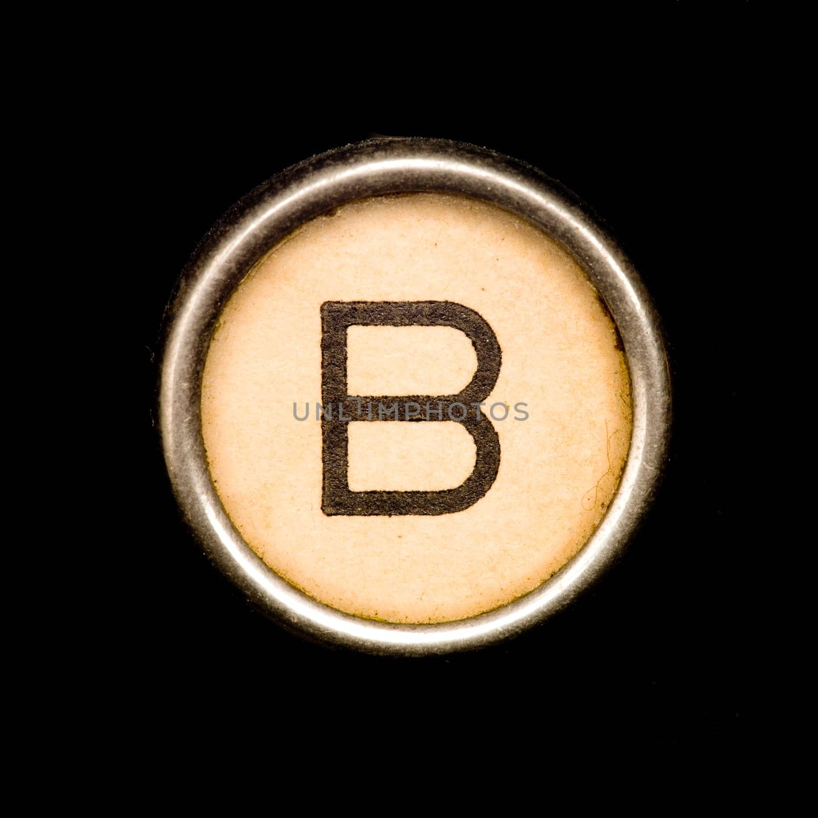 The B button on a complete alphabet of an antique typewriter