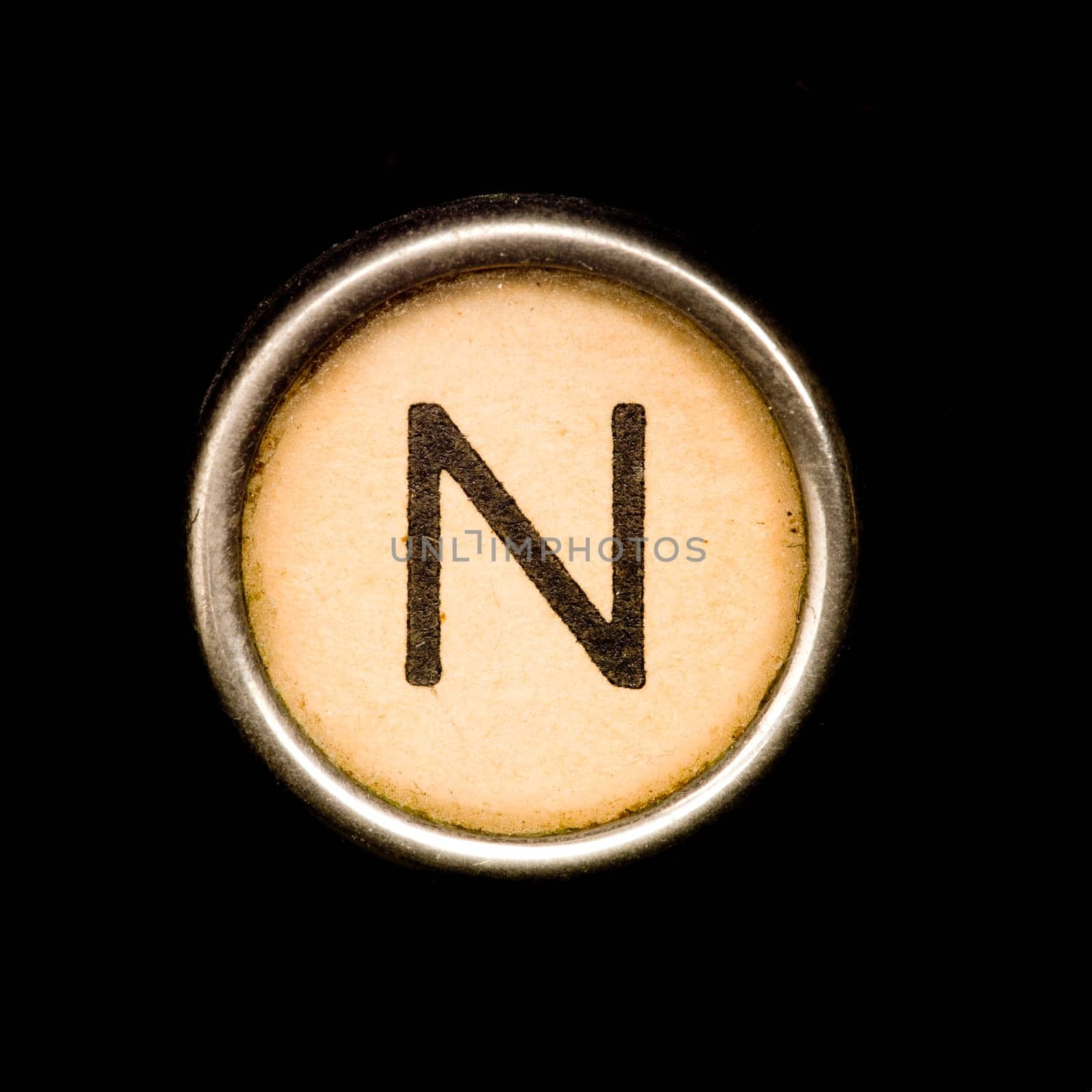 The N button on a complete alphabet of an antique typewriter