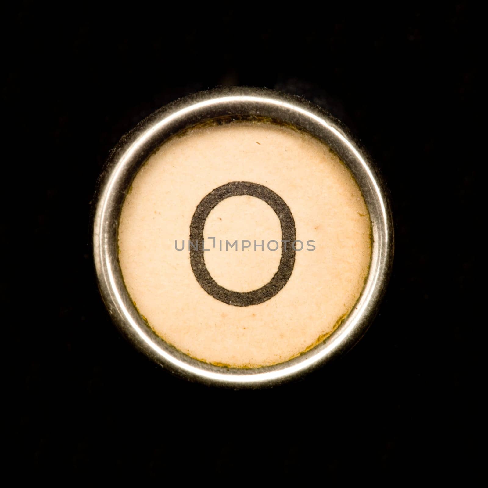 The O button on a complete alphabet of an antique typewriter