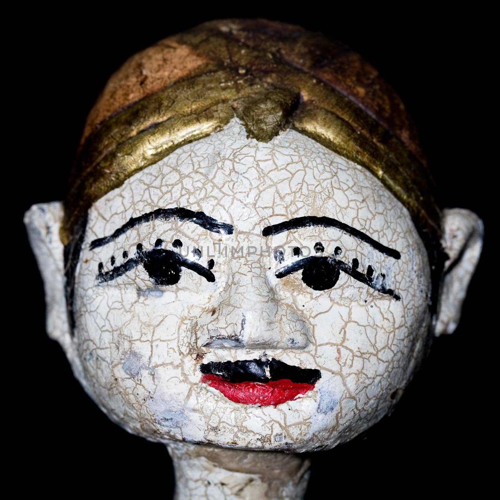 Antique indonesian puppet for sale in an antique shop