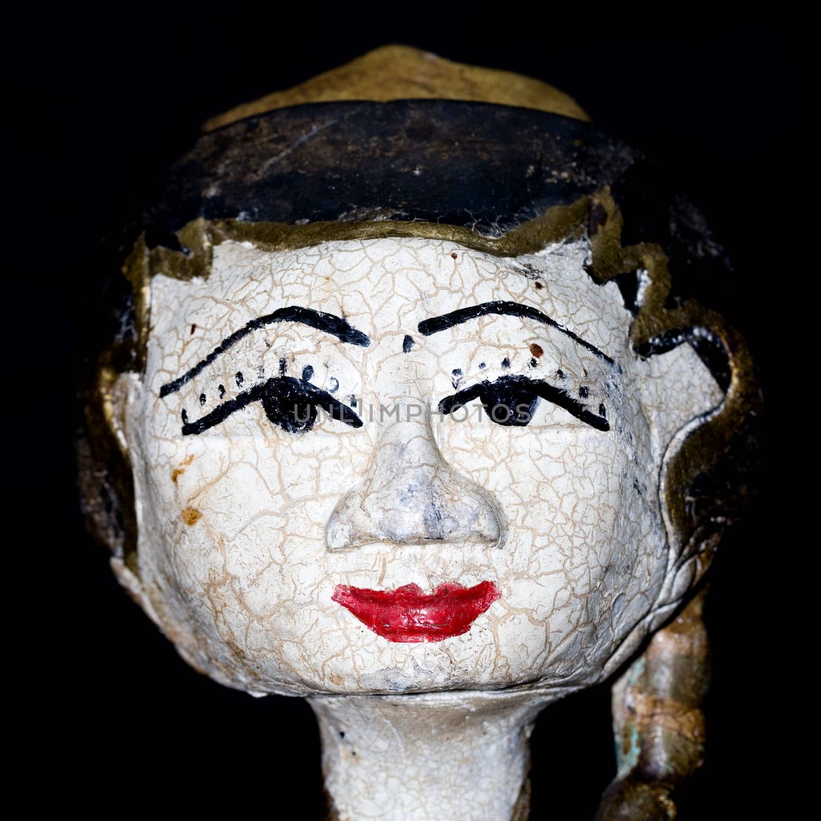 Antique indonesian puppet for sale in an antique shop