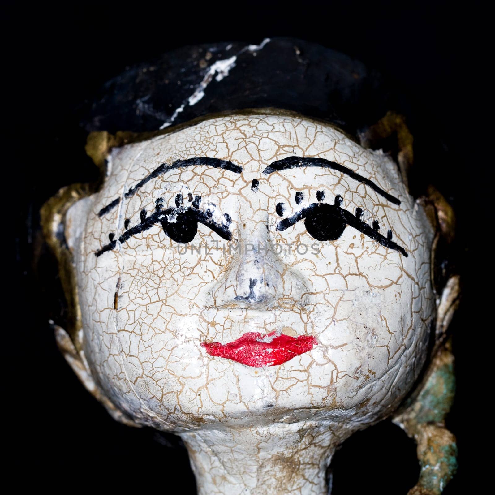 Antique indonesian puppet for sale in an antique shop