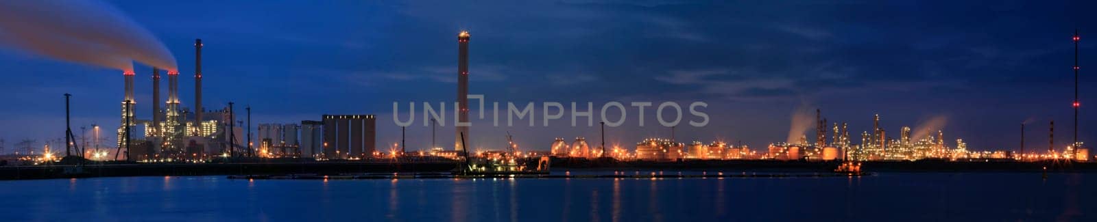 Panorama of a refinery at night at Europoort, Rotterdam, Holland