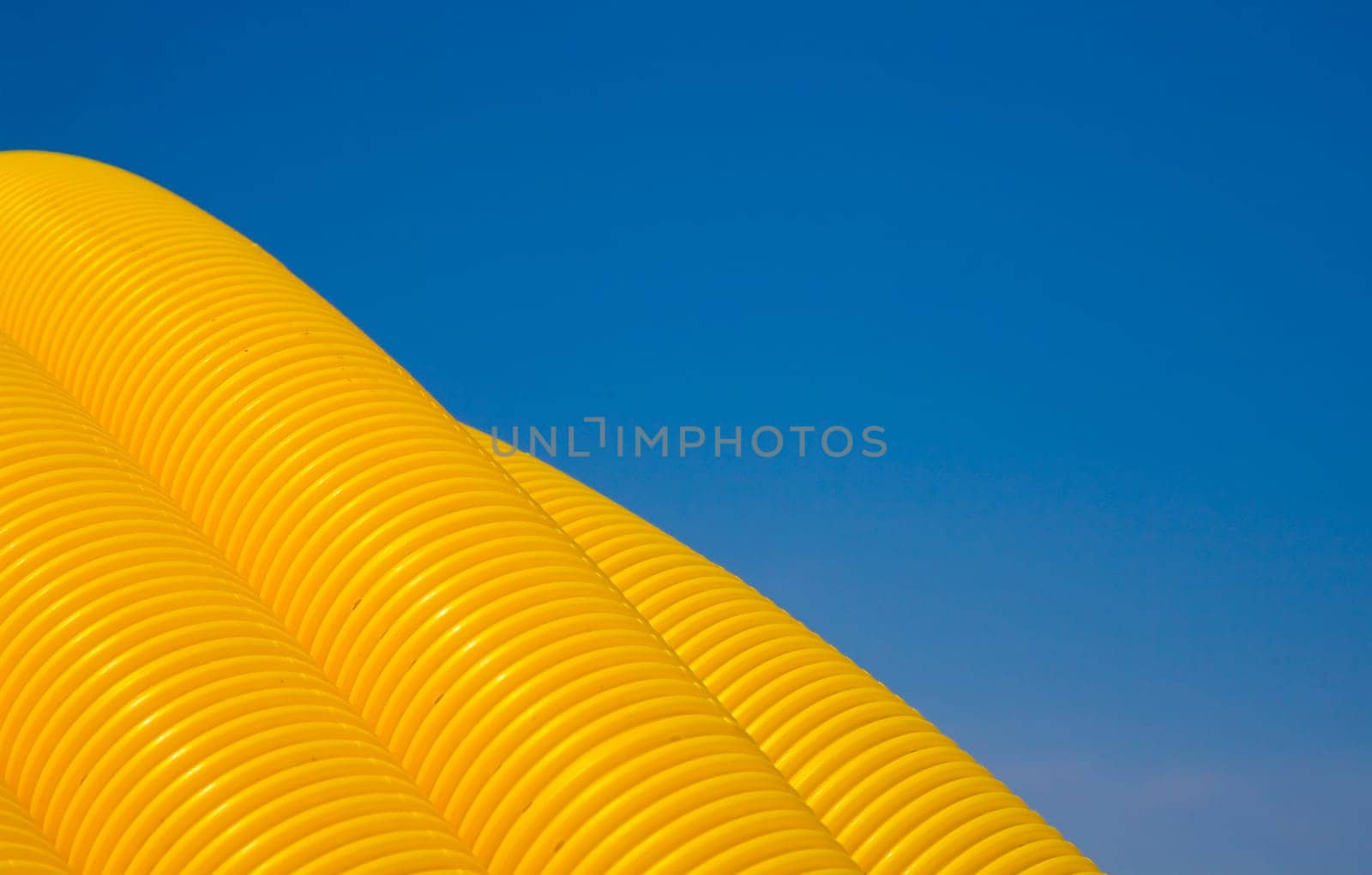 Close up of yellow tubes on a construction site