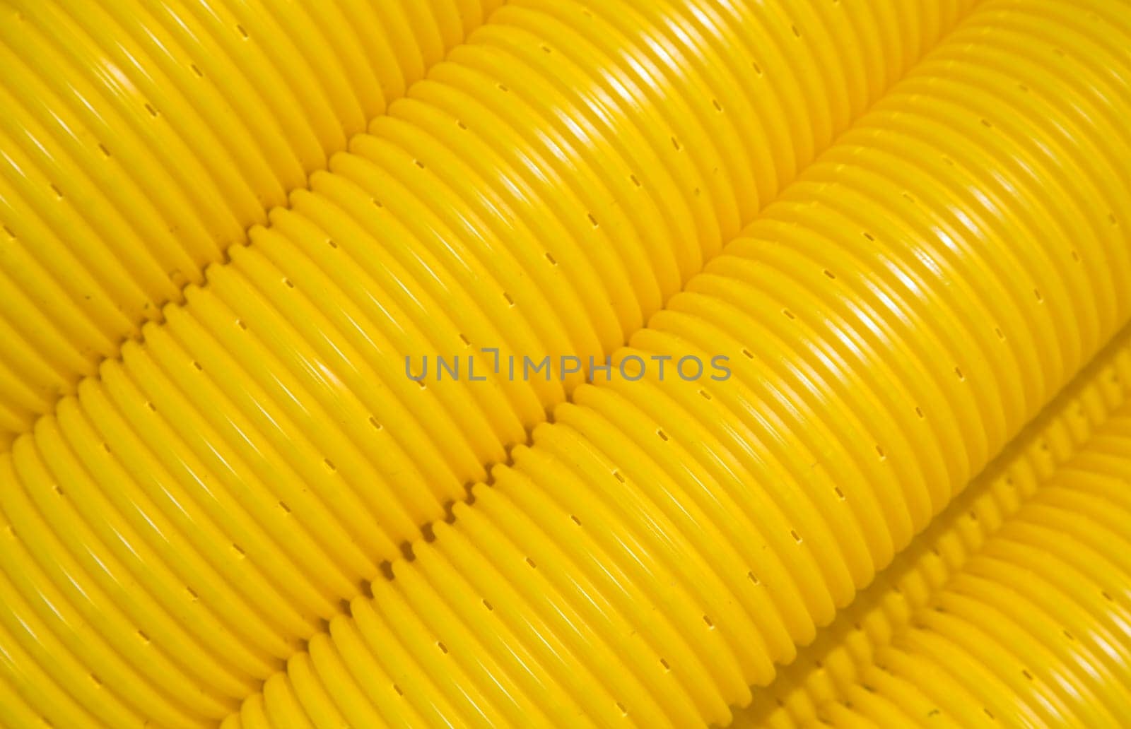 Close up of yellow tubes on a construction site