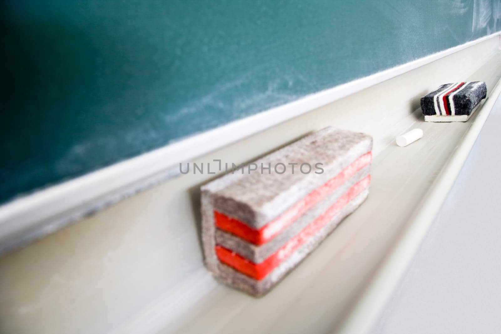 Used green chalkboard with eraser and chalk