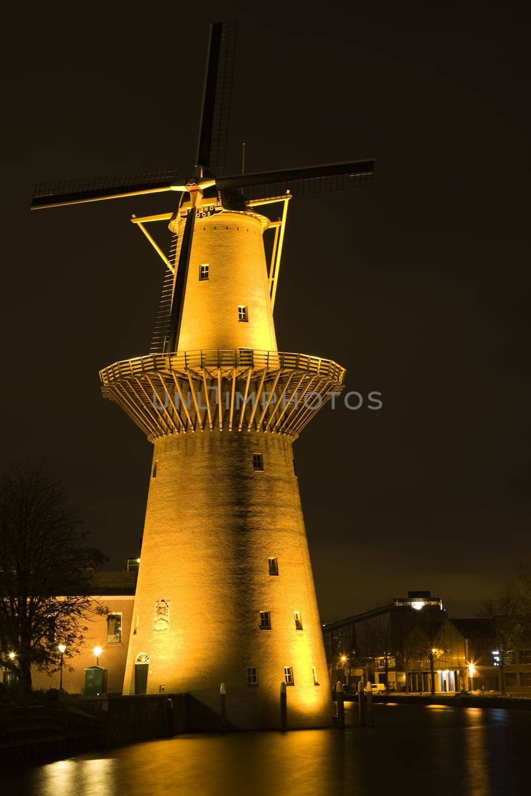 Dutch windmill at night in Schiedam, Holland