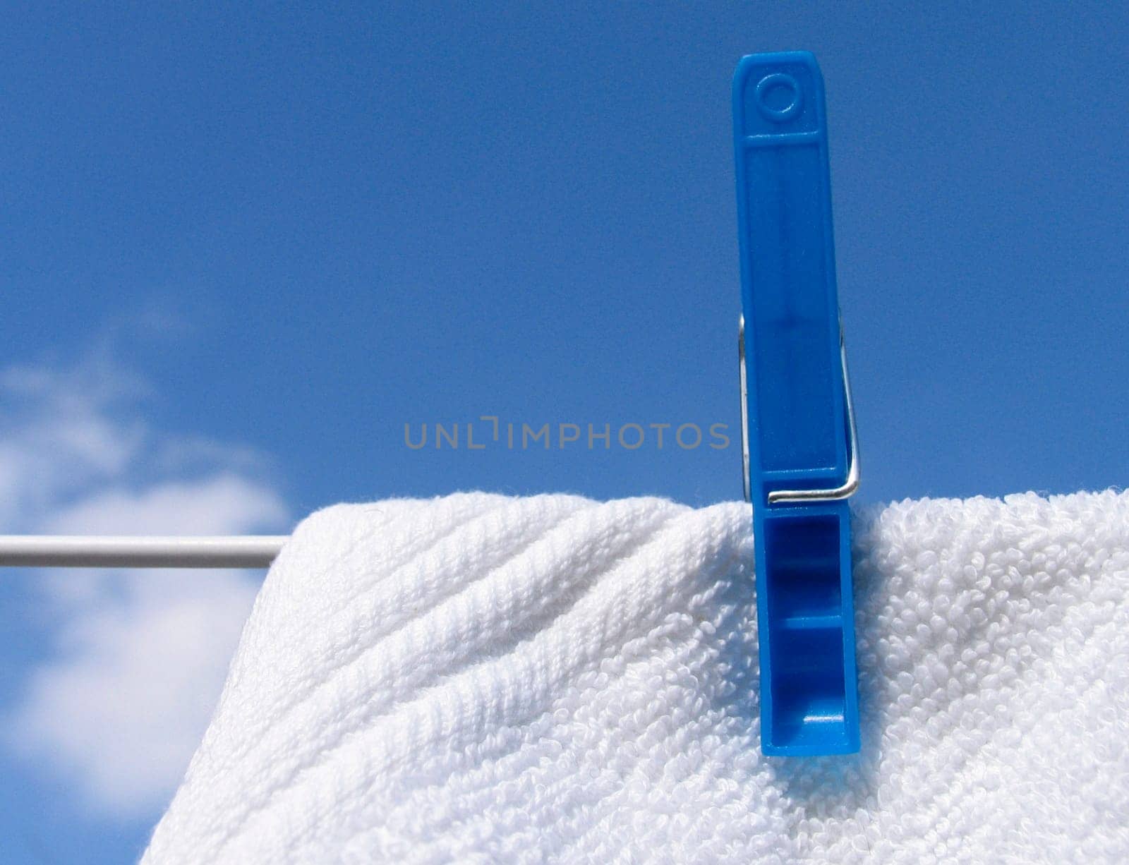 Clothes line against blue sky