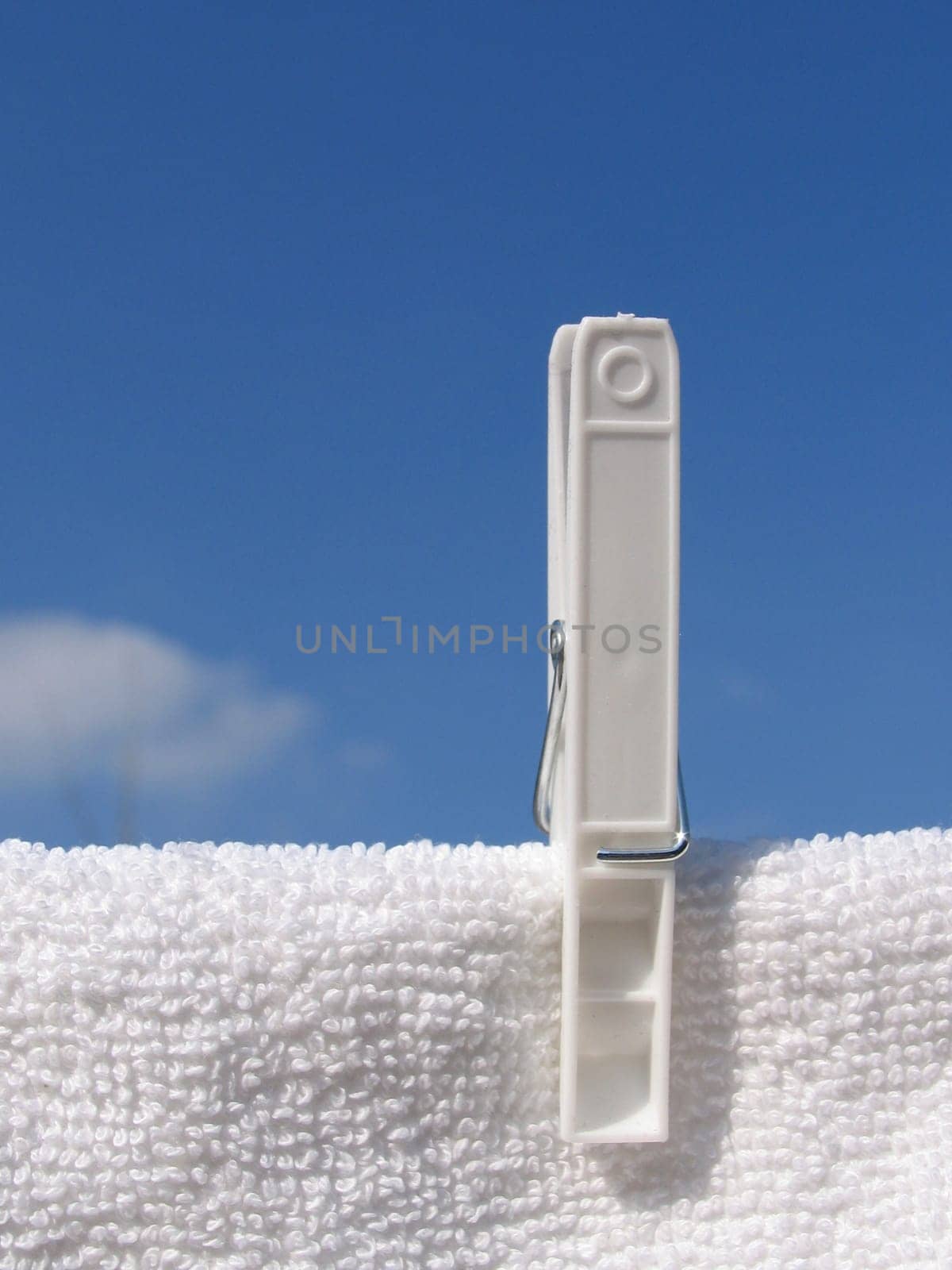 Clothes line against blue sky