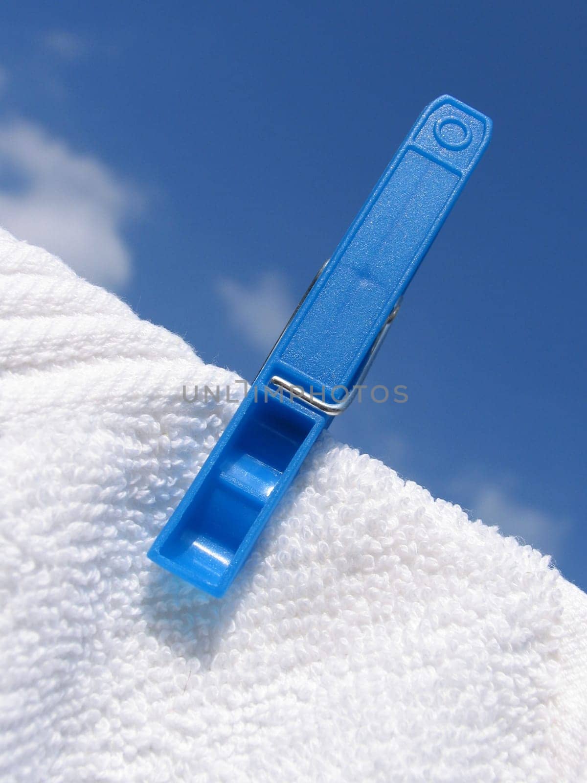 Clothes line against blue sky