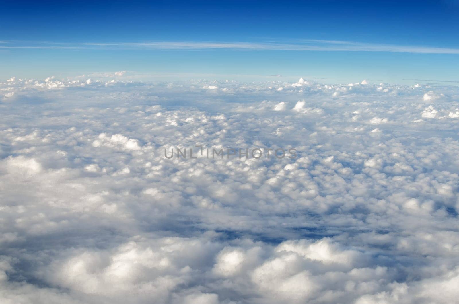White clouds seen from above set against a blue sky