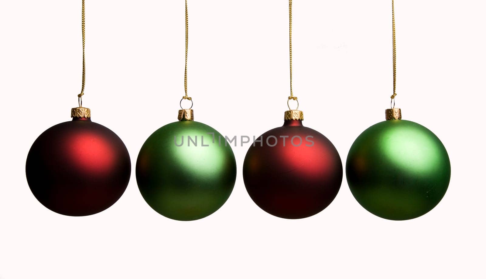 Green and red Christmas balls on a white background