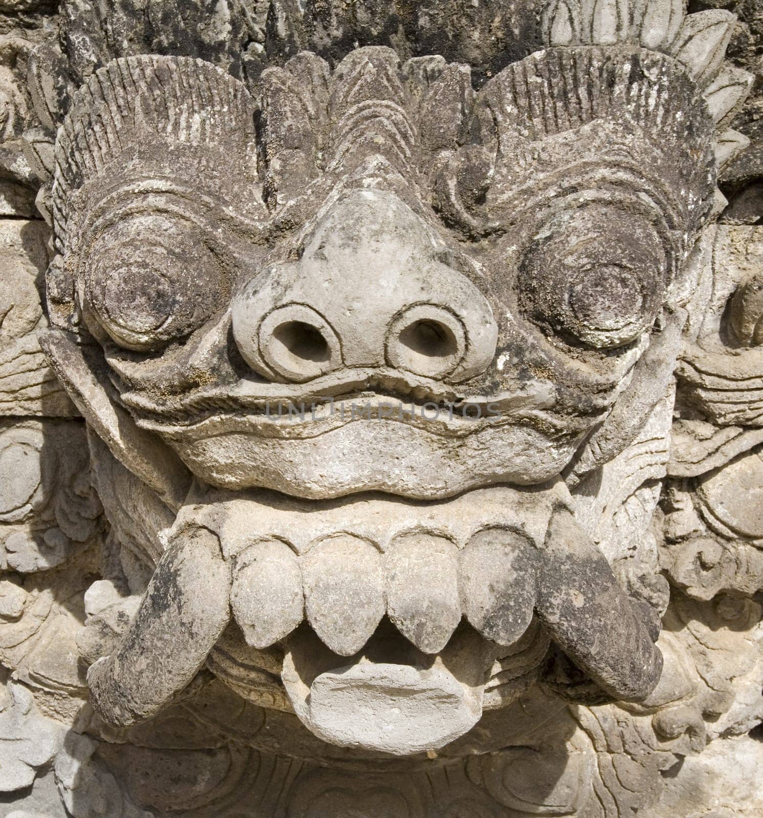 Balinese carved statue guarding a temple