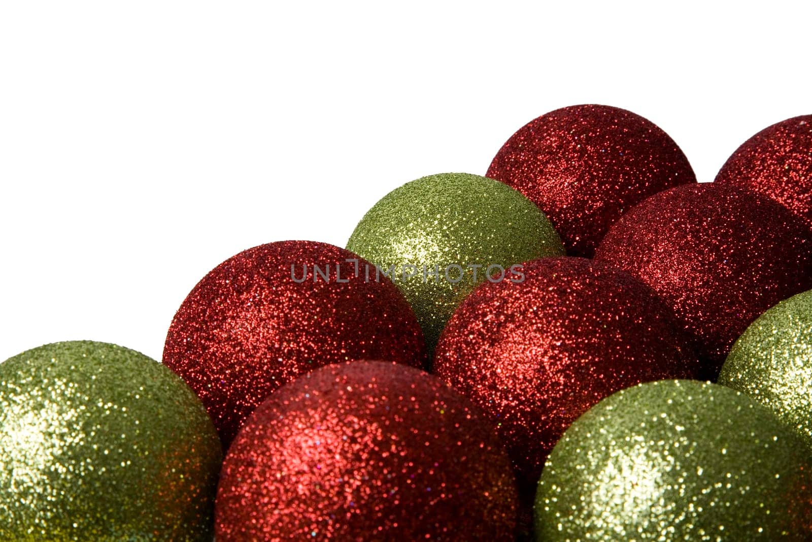 Green and red Christmas balls on a white background