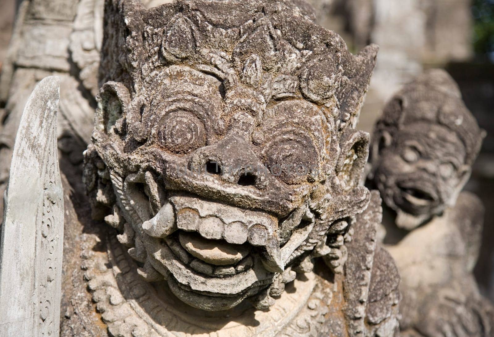 Balinese carved statue guarding a temple