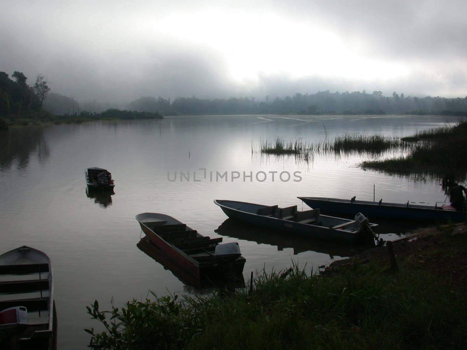 A misty sunset over a lake in Malaysia