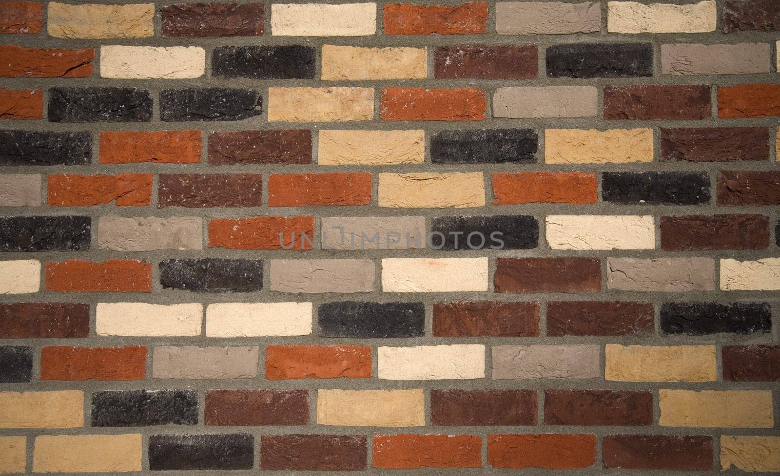 Brick wall background of various colored bricks