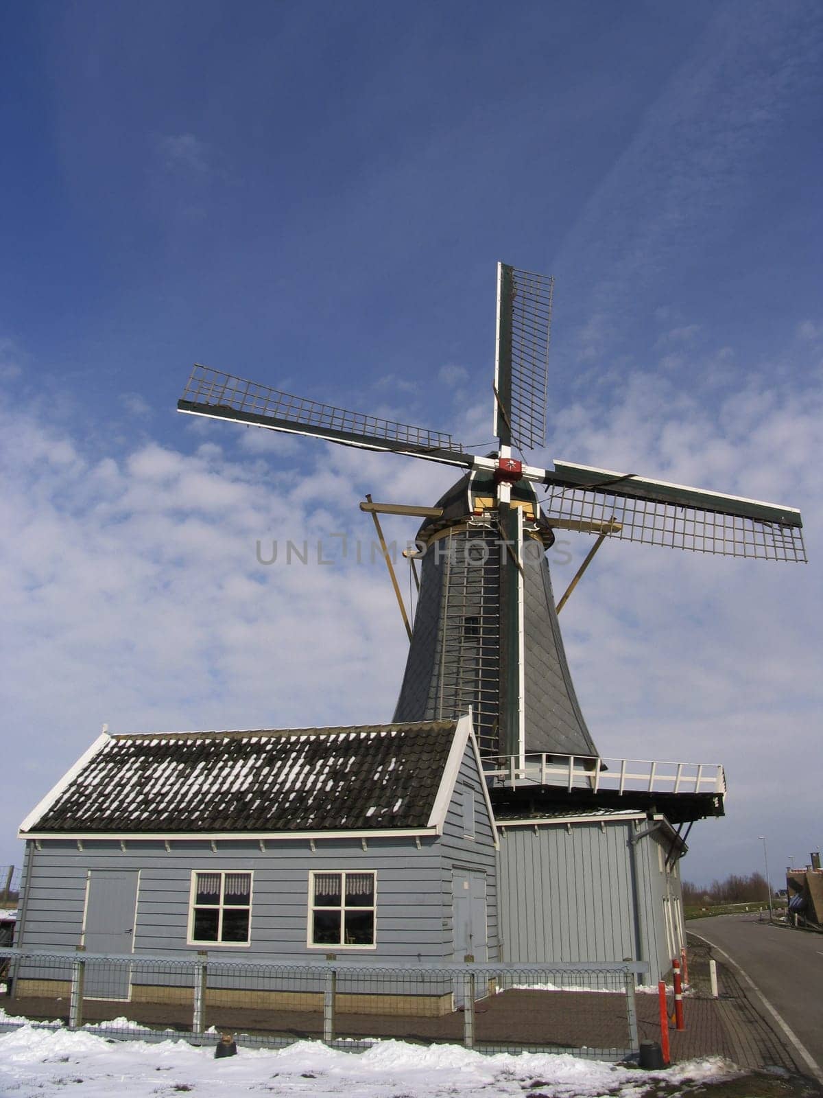 A Dutch windmill alongside the river Rhine, Streefkerk, Holland