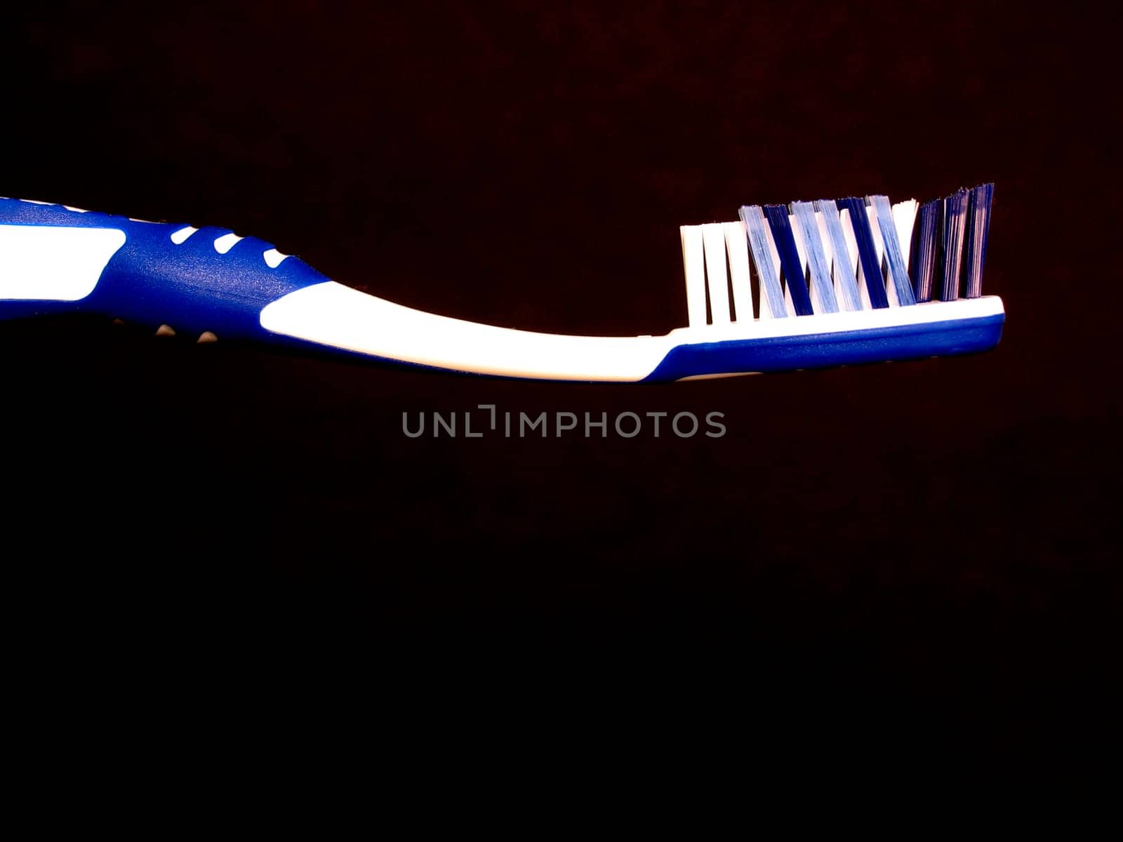 Tooth brush against black background