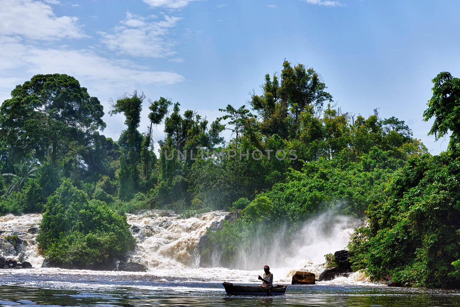 The fisherman under the waterfall
