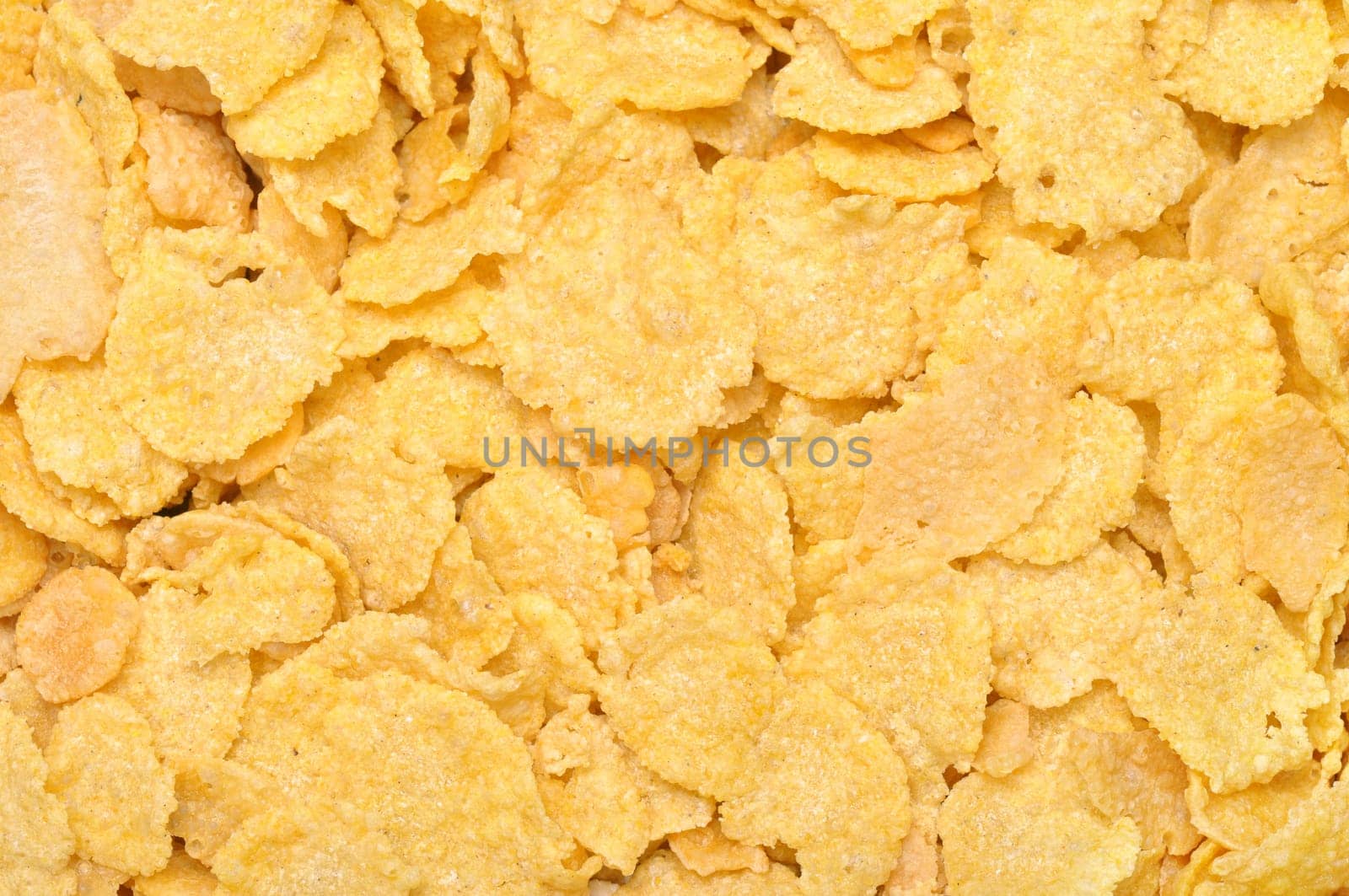 Corn flakes texture background. Healthy food for breakfast.