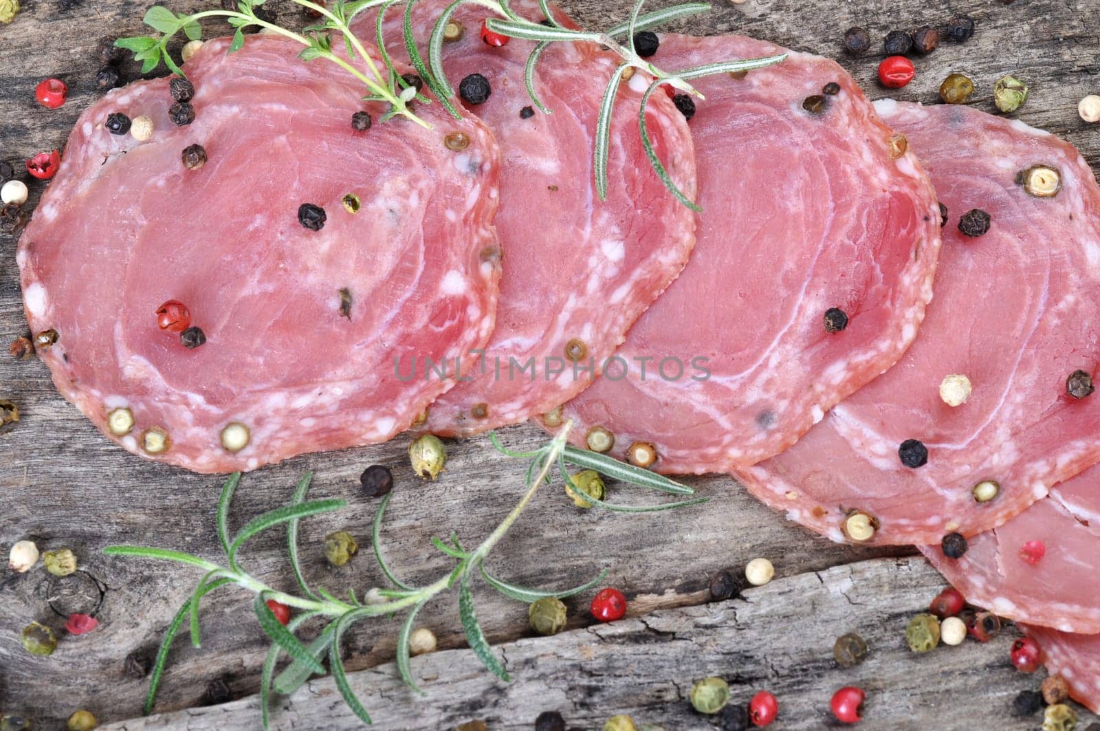 Dried sausage on a wooden board (Kindzukas). Traditional sausage in Lithuania.