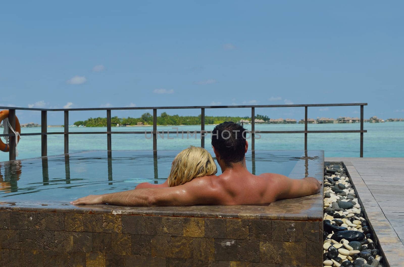 happy young  couple at summer vacation have fun and relax at beautiful sunny  day on beach