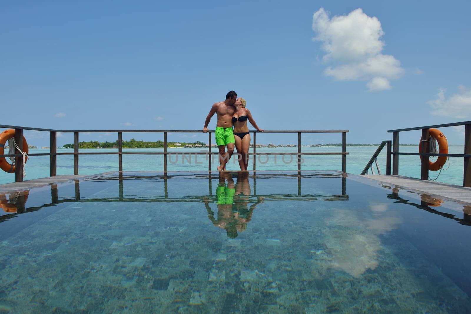 happy young  couple at summer vacation have fun and relax at beautiful sunny  day on beach