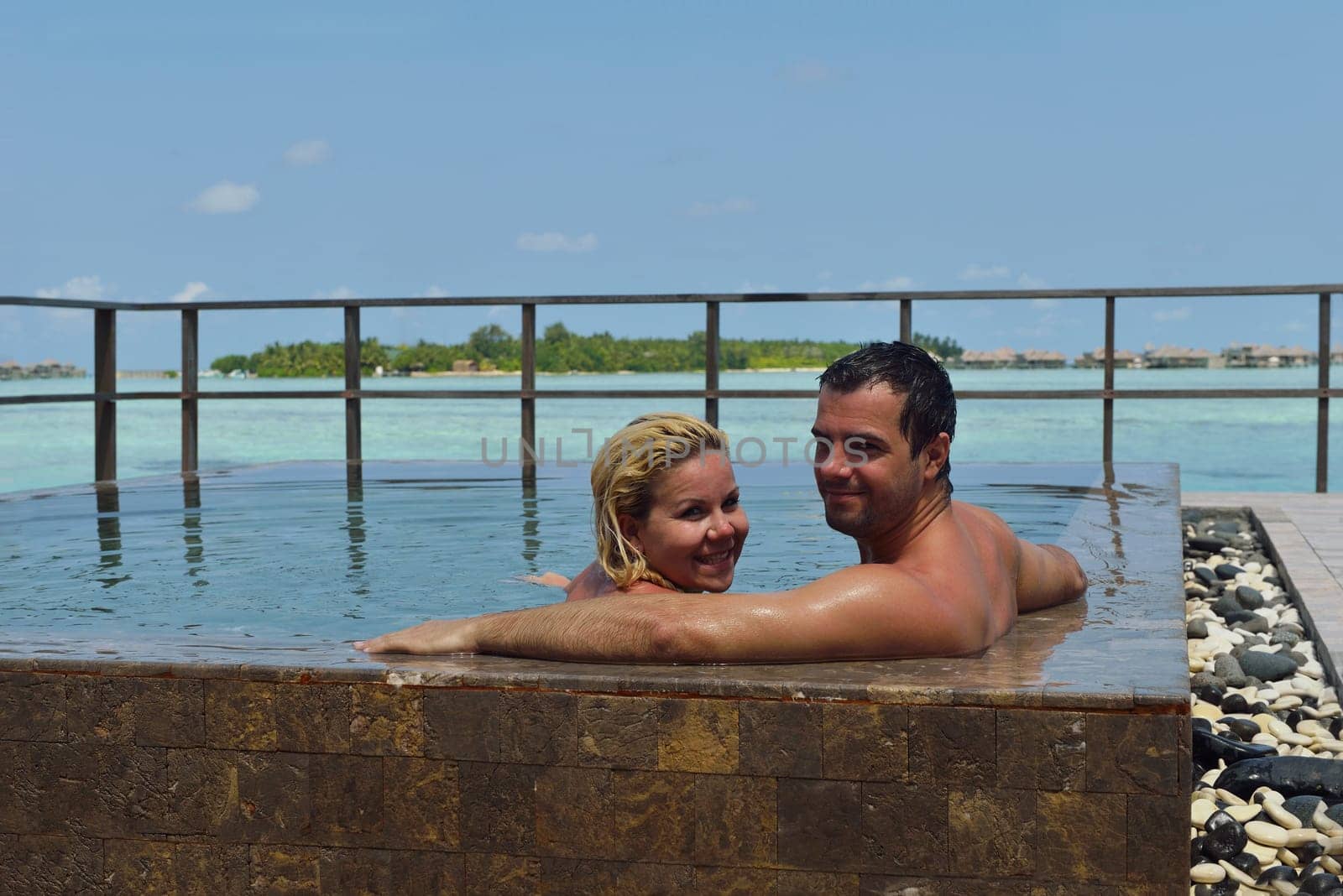 happy young  couple at summer vacation have fun and relax at beautiful sunny  day on beach