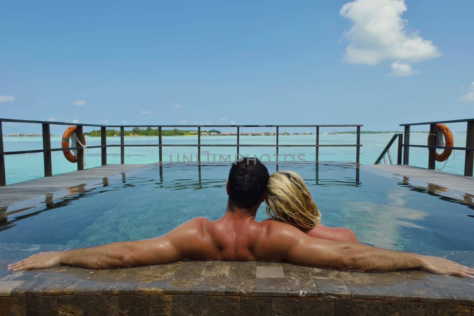 happy young  couple at summer vacation have fun and relax at beautiful sunny  day on beach