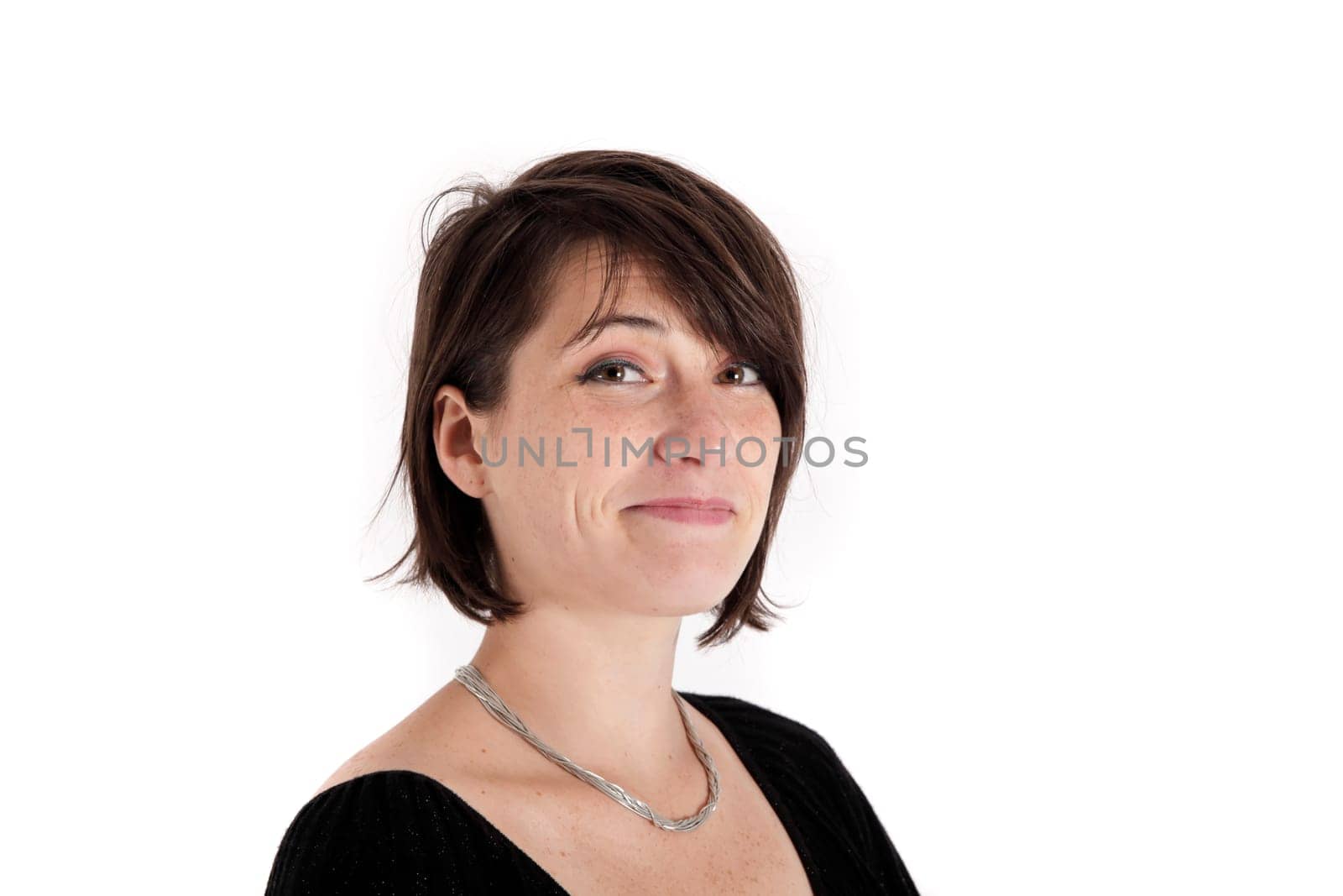 variation of expression on the face of a young brunette woman in studio with a colored scarf