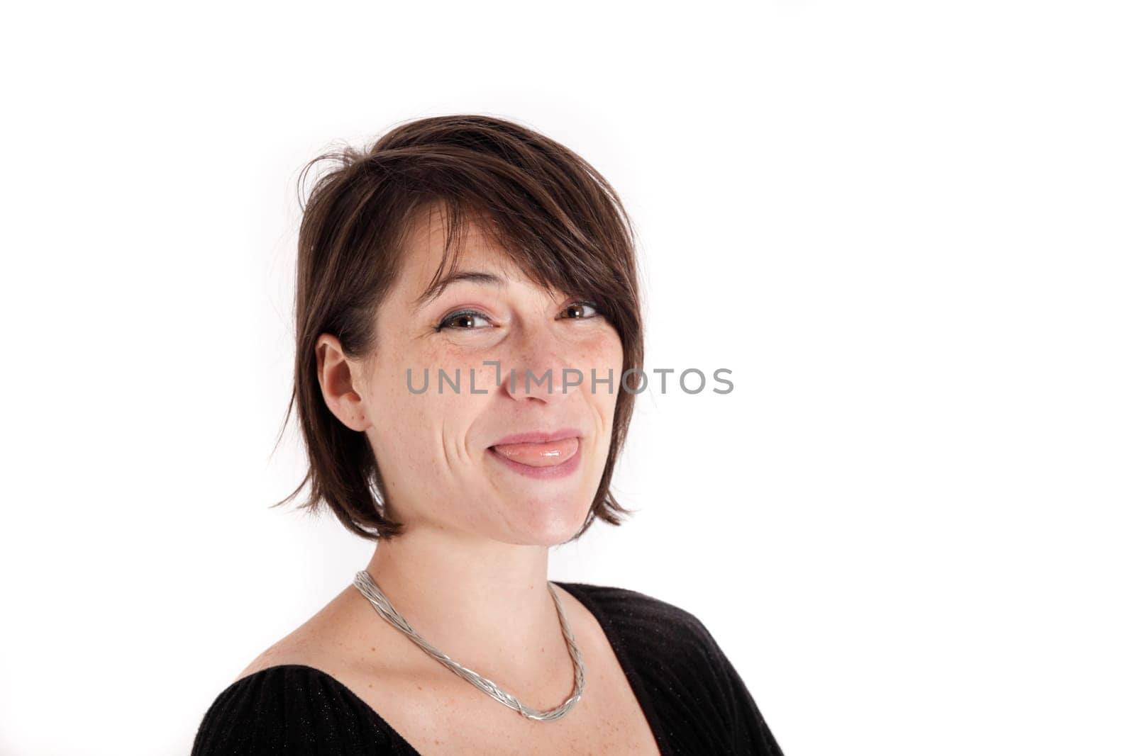 variation of expression on the face of a young brunette woman in studio with a colored scarf