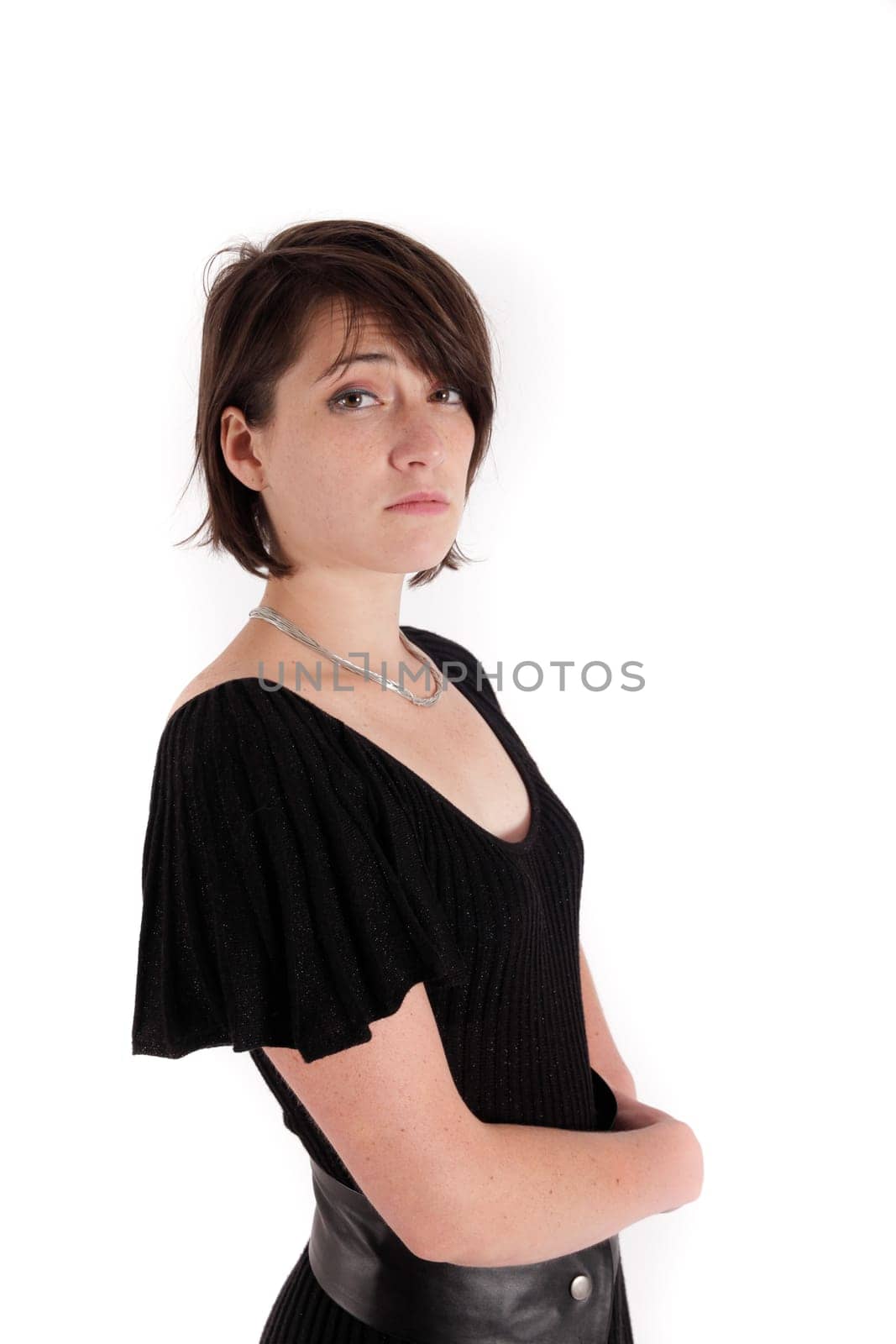 variation of expression on the face of a young brunette woman in studio with a colored scarf