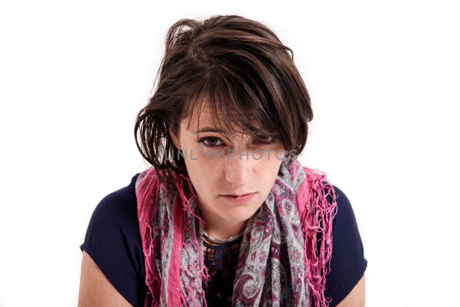 portrait of a young brunette woman with colored scarf looking ahead